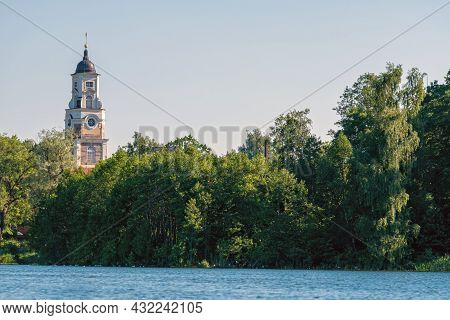 Aluksne Evangelical Lutheran Church Tower Above The Tree Tops, View From The Lake, Latvia