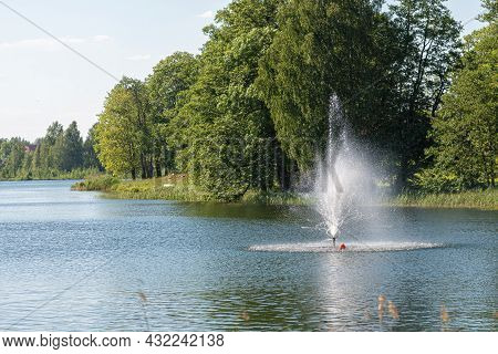 Fountain In Lake Aluksne Near Pilssala On A Sunny Summer Afternoon, Aluksne, Vidzeme, Latvia