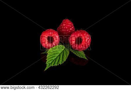 Raspberry Isolated. Raspberries With Leaf Isolate. Raspberry With Leaf Isolated On Black Background