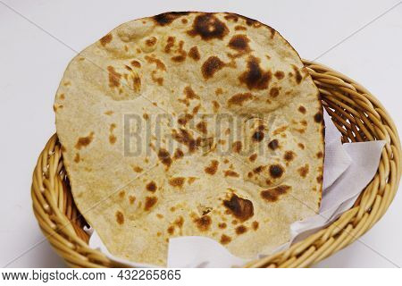 Tandoori Naan Bread Or Roti In A Basket, Indian Clay Oven Baked Bread