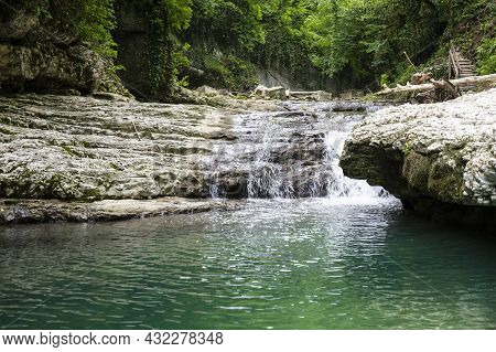 The Olginsky Waterfall In The Republic Of Abkhazia. Cloudy Day On May 21, 2021