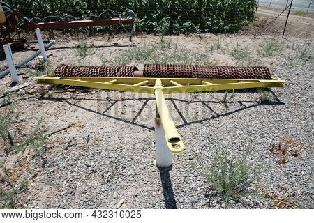 Tillage Equipment to pull behind a tractor. Agricultural workers and tractors, tillage machines, tillage and plowing for farming.