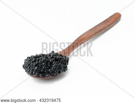 Fresh Grainy Black Paddlefish Caviar In Brown Wooden Spoon On White Background, Close Up