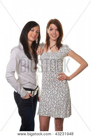 two young girls whispering to the latest news