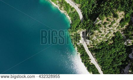 Aerial Summer View Of Pivsko Lake. Road With Tunnel Near The Piva River, Montenegro