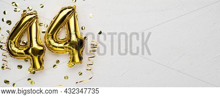 Golden Foil Balloon Number Forty Four. Birthday Or Anniversary Card With The Inscription 44. Gray Co