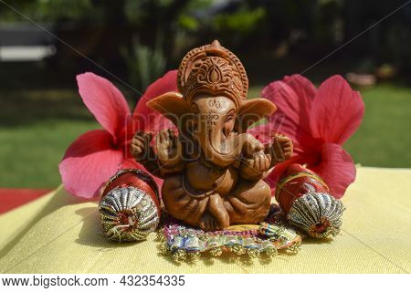 Lord Ganapati Sitting Idol With Pillows And Bolsters At Home During Ganesh Chaturthi Festival At Hom
