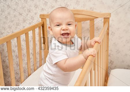 Cute Small Boy At House. Childhood Concept. Light Background. Smiling Child. Happy Emotion. Copyspac