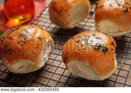 Traditional Ukrainian Bread (pampushky) With Garlic On Baking Grid, Closeup