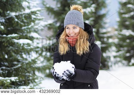 Portrait Beautiful Happy Girl Whitework Smile Teeth, Blue Eyes Playing With Snow On Spruce Backgroun