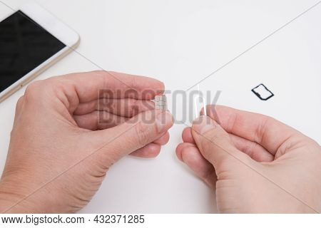 Removing A Sim Card Out Of A Smartphone, Replacing Simcard And Changing Number