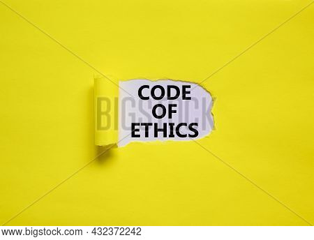 Code Of Ethics Symbol. Words 'code Of Ethics' Appearing Behind Torn Yellow Paper. Beautiful Yellow B