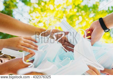 Close Up Photo Of People Hands Gather Together A Lot Of Medical Masks And Keeping Them In Their Hand