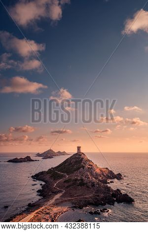Sunset Over The Genoese Tower And Lighthouse At Pointe De La Parata And Les Iles Sanguinaires Near A
