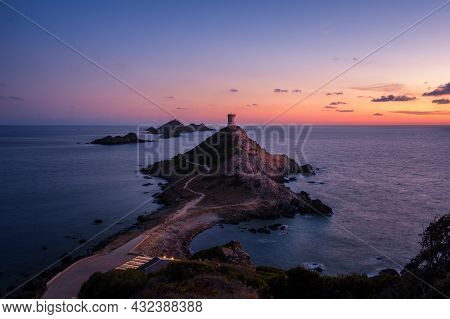 Sunset Over The Genoese Tower And Lighthouse At Pointe De La Parata And Les Iles Sanguinaires Near A