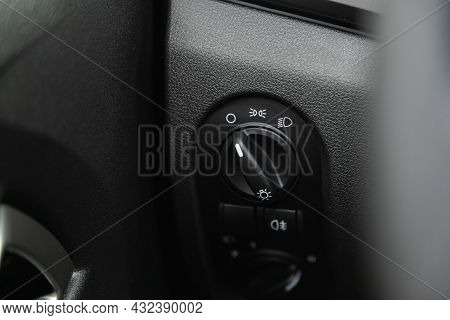 Novosibirsk, Russia - July 19, 2021: Lada Granta , Close Up Shot Of Car Headlight Setting Control Pa