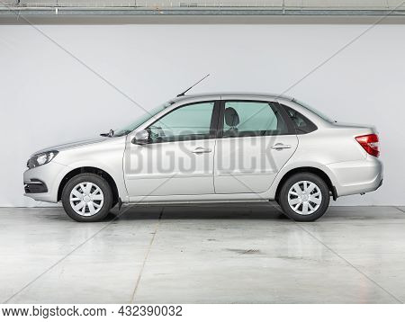 Novosibirsk, Russia - July 19, 2021: White Lada Granta , Side View. Popular Car On A Parking