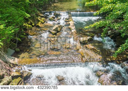 Waterfalls On Zylica River Among Grass And Trees At Summer Time.