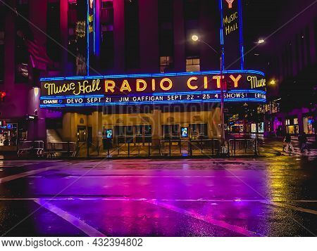 Exterior Of The Iconic Radio City Music Hall Theatre (home Of The Rockettes) With Colorful Neon Marq