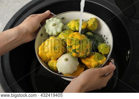 Woman Washing Pattypan Squashes Above Sink, Closeup