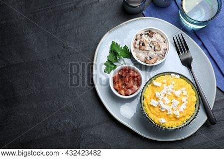 Traditional Ukrainian Banosh Served With Brynza, Pork Cracklings And Mushrooms On Black Table, Flat 