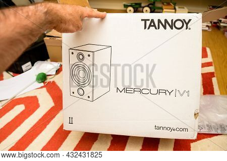 Paris, France - Jun 14, 2021: Pov Male Hand Looking At The Tannoy Mercury V1 Loudspeaker Package Dur