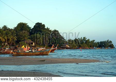 Fisherman's Fishing Boat On Sand At A Fishing Village Beach,stranded Fishing Boat After The Sea Has 