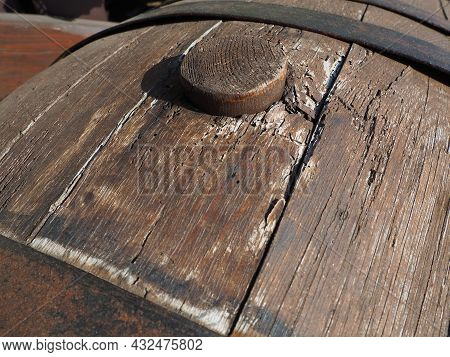 A Traditional Old Wooden Barrel With Curved Walls And Metal Hoops. Dishes For The Ripening Of Alcoho
