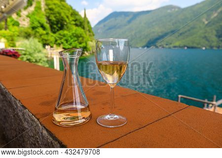 Rose Wine By The Lakefront Of Lugano City In Switzerland. Romantic Appetizer In Ticino Canton On Swi