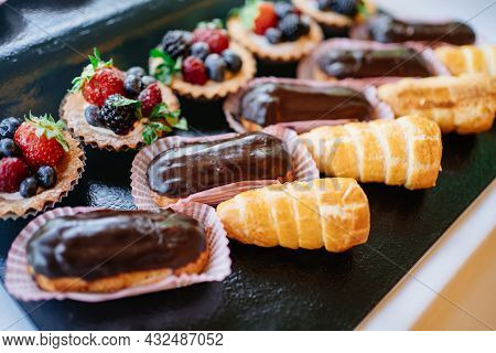 Assorted Cakes For The Holiday. Candy Bar. Sweet Birthday Treats.