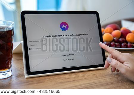 Alanya, Turkey - June 2, 2021: Woman Hand Holding Ipad Air Space Gray On The Table With Social Netwo