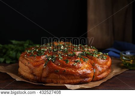 Traditional Ukrainian Garlic Bread With Herbs (pampushky) On Wooden Table, Closeup