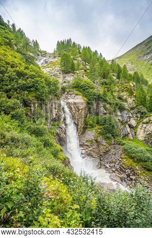 Wild Alpine Waterfall On Schlatenbach Mountain Stream. Gschloesstal Valley, Hohe Tauern National Par