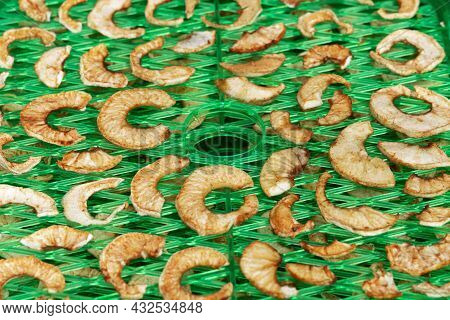 Apple Slices On The Special Drying Device. Preparation Apple Chips At Home.
