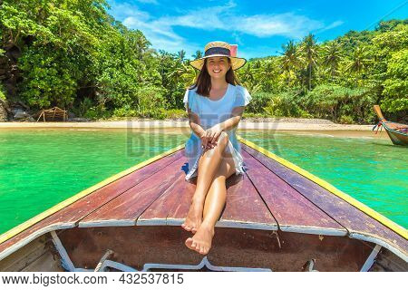 Happy Traveler Woman Relaxing On Boat Near Tropical Island In Thailand