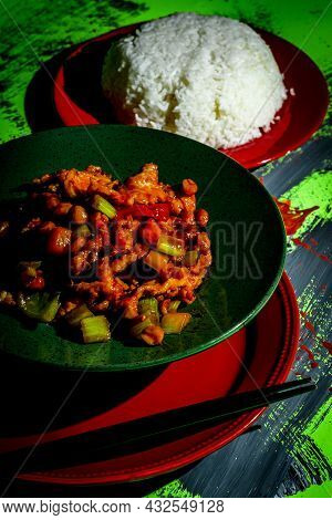 Takeout Chinese Kung Pao Chicken With Peanuts And Mixed Vegetables And White Rice