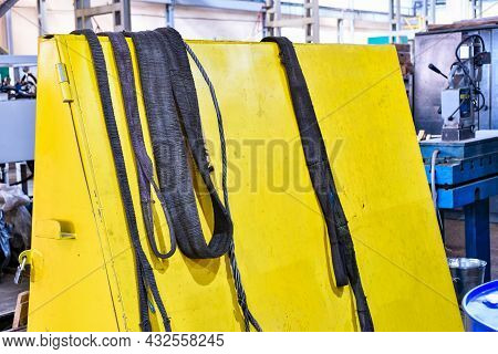 Nylon Slings For Lifting Loads On The Telpher Crane Lie On The Rack.