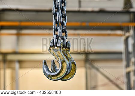 Hooking The Load With Chains For Lifting On A Telpher Crane.