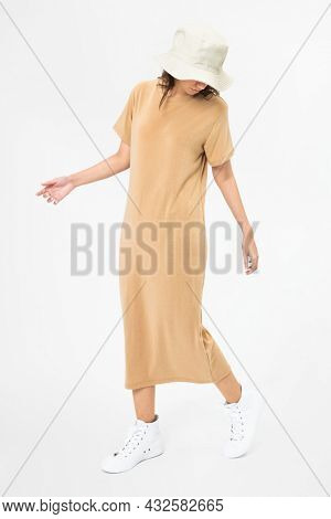 Woman in beige t-shirt dress and bucket hat casual wear apparel
