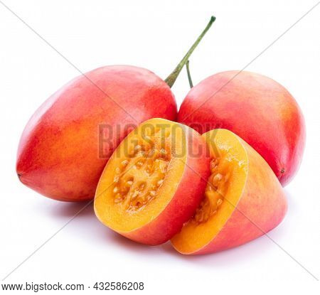 Ripe tamarillo fruits with tamarillo slices  isolated on a white background.