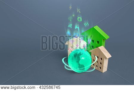 Residential Building And Globe With Environmental Symbols. Energy Efficiency, Autonomy And Natural R