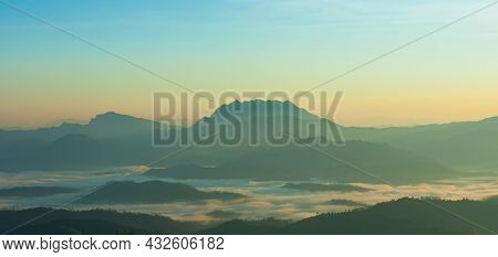 Orange Sunlight On Nature Mountain And Fog View, Beautiful Sunlight On Sky With Colorful Blue, Orang