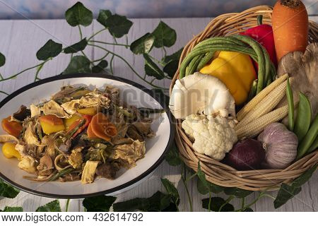 A Serving Of Chop Suey Or Chop Choy With The Raw Ingredients In A Rattan Basket. Chop Suey Is Stir F