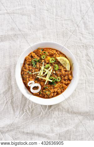 Keema Curry In Bowl Over Light Background. Indian And Pakistani Style Dish. Top View, Flat Lay