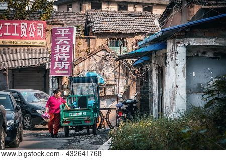 Shanghai, China - November 5, 2019: Local street food on Ninghai East Road close to the city center. These street food typical for old residential district also known as a shikumen houses.