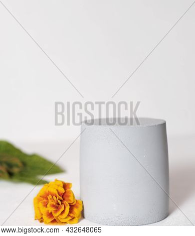 Grey Cilinder Podium With Fall Decor For Product Placement. Autumn Sale Concept. Orange Flower Next 