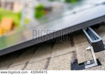 Rail, Bracket, And Anchor To A Solar Panel Installed On A Asphalt Shingle Roof