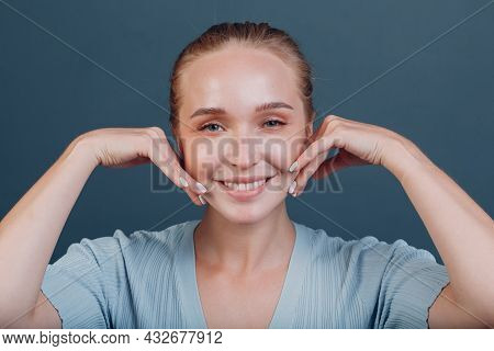 Millenial Young Woman Blonde Hair Portrait Doing Face Yoga Self Facebuilding Massage For Face Skin.