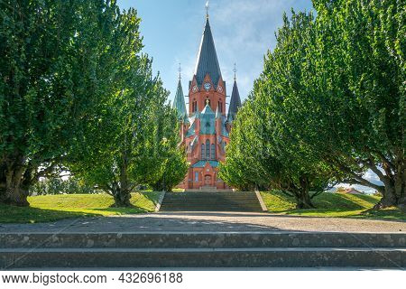 Red Brick Building Of The Sankt Petri Kyrka, Or Saint Peter Church, In Vastervik, Sweden, On A Sunny