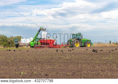 Ukraine, Khmelnytsky Region, September 2021. Loading Grain Into The Seeder In The Field During The S